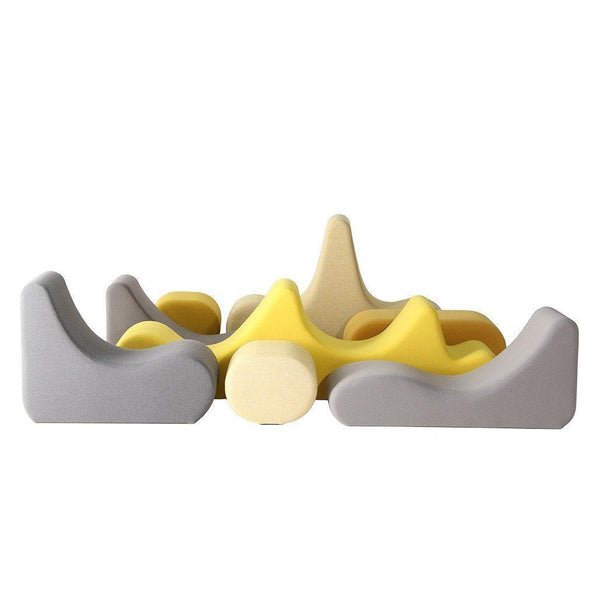 Colorful modern seating with shades of yellow and gray, featuring playful organic shapes and smooth textures.