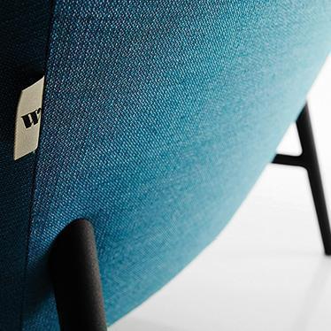Teal and black textured chair showcasing a gradient pattern, perfect for modern decor.