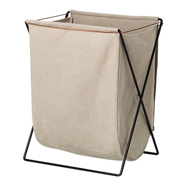 Beige fabric laundry basket with black metal frame, featuring a simple, modern design and no visible patterns.