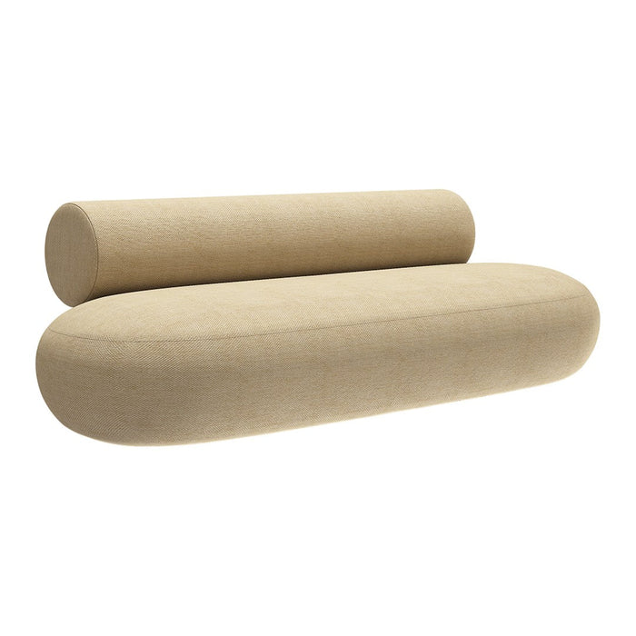 Beige oval sofa with textured fabric and seamless design, featuring a matching cylindrical bolster cushion.