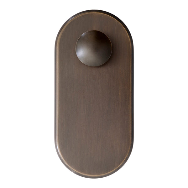 Bronze oval door knob with a smooth finish and matching plate, featuring a minimalist design. Ideal for modern decor.