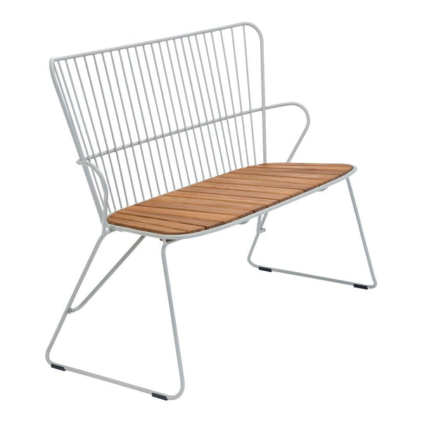 Modern wire bench with a sleek white frame and warm wooden slats, perfect for contemporary outdoor or indoor spaces.