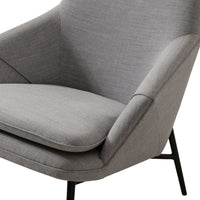 Stylish gray accent chair with smooth fabric and clean lines, perfect for modern home decor.
