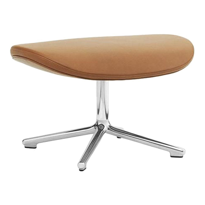 Tan upholstered ottoman with a smooth, curved shape and sleek chrome base. Modern, minimalist design.