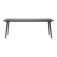 Sleek black rectangular table with simple, modern design and tapered legs, ideal for contemporary dining spaces.