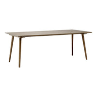 Natural wood dining table featuring a smooth, light brown finish and sleek, tapered legs. Minimalist and stylish design.