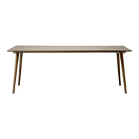 Light brown rectangular table with smooth surface and tapered wooden legs, showcasing a minimalist design.