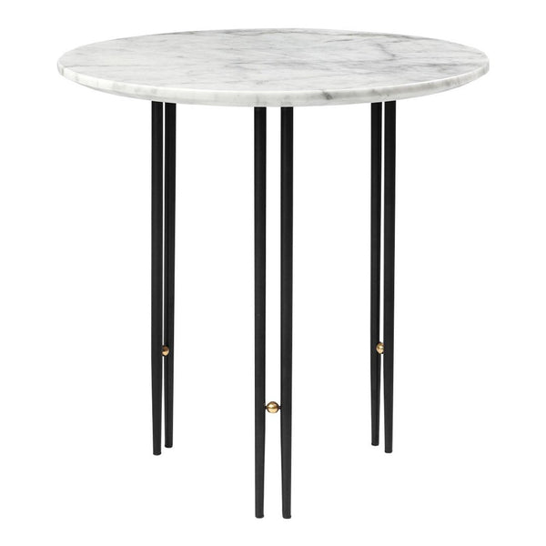 Round marble tabletop in white with gray veining, supported by sleek black legs featuring gold accents.