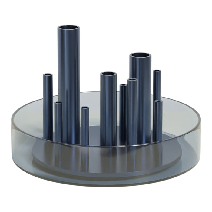 Blue metallic tubes in varying heights on a clear circular base, creating a modern, stylish design.