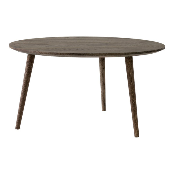 Round wooden table in a rustic gray finish with simple, clean lines and tapered legs—perfect for modern decor.