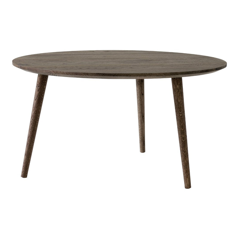 Round wooden table in a rustic gray finish with simple, clean lines and tapered legs—perfect for modern decor.