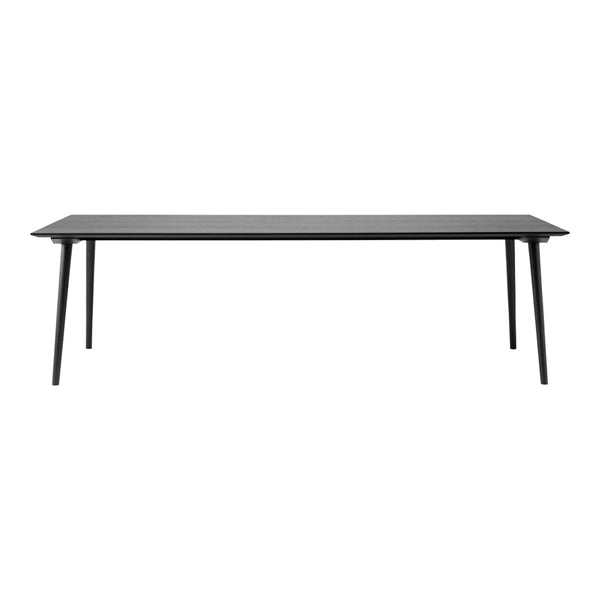 Sleek black dining table with clean lines and minimalistic design, perfect for modern interiors.