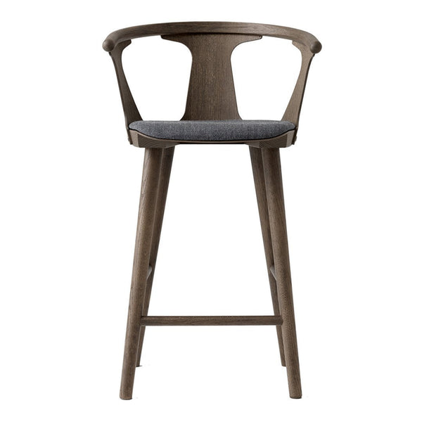 Gray upholstered seat with a light brown wooden frame, minimalistic design, and smooth finish.