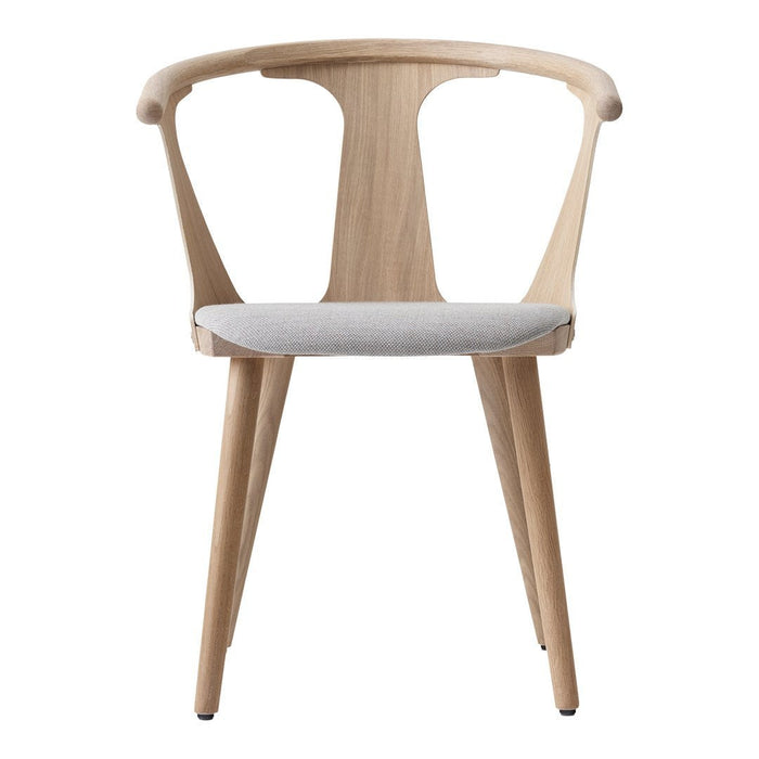Light natural wood chair with a soft gray seat and sleek, modern design. Perfect for contemporary interiors.