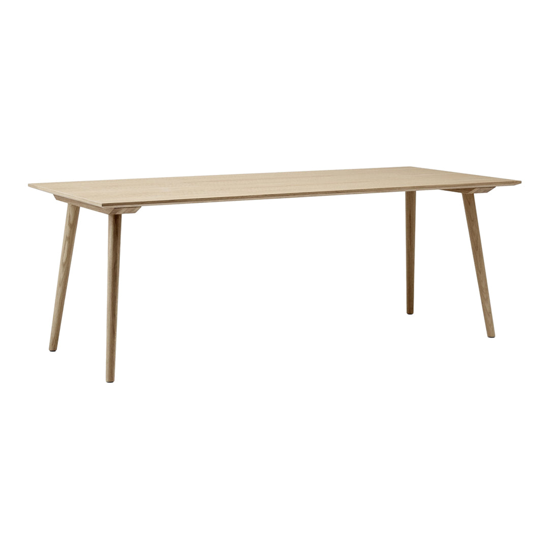 Light natural wood dining table with a smooth, minimalist design and tapered legs. Perfect for modern decor.