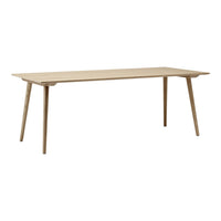 Light natural wood dining table with a smooth, minimalist design and tapered legs. Perfect for modern decor.