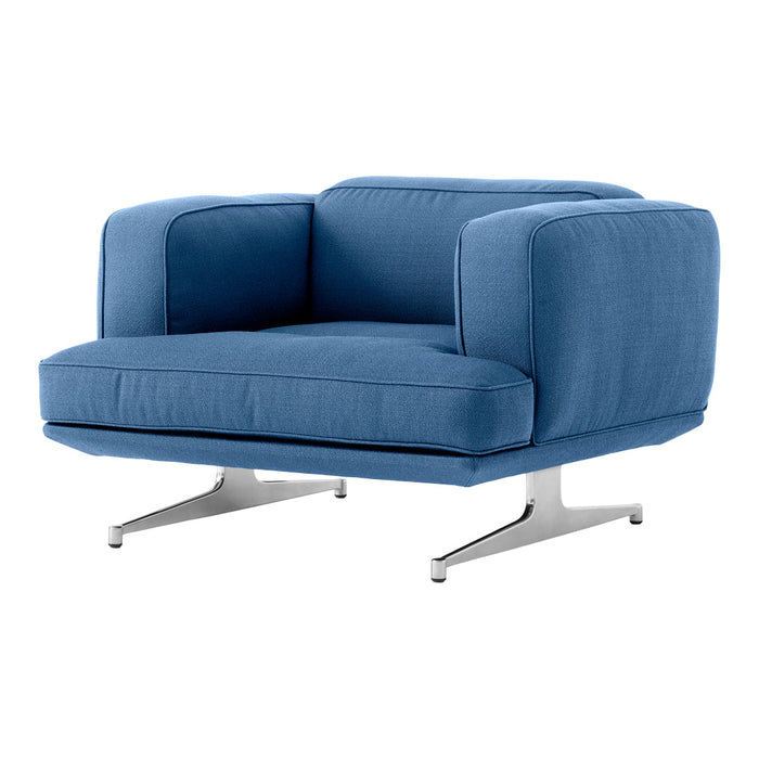 Blue upholstered chair with a modern design and sleek silver legs, featuring a minimalist style and solid color fabric.