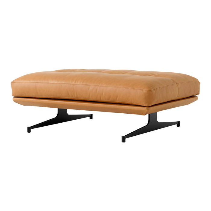 Tan leather ottoman with a smooth surface and sleek black metal legs. Modern design for contemporary interiors.