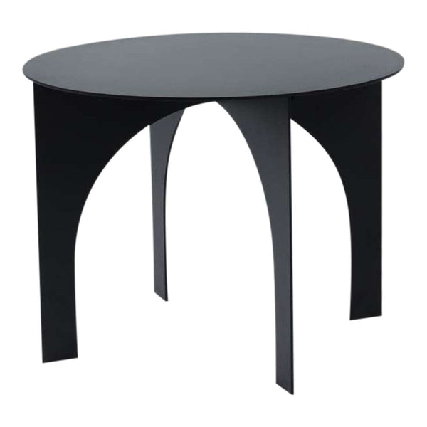 Round black table with sleek, minimalist design and arch-shaped legs, perfect for modern interiors.
