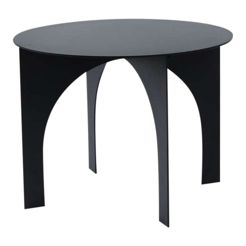Round black table with sleek, minimalist design and arch-shaped legs, perfect for modern interiors.