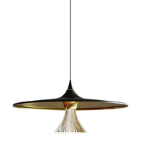 Sleek black and gold pendant lamp with a unique flared design and white fringed accent. Perfect for modern decor.