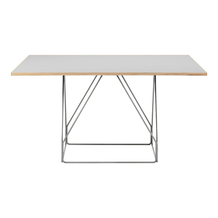 White rectangular tabletop with natural wood edge and minimalist metal base in silver finish. Modern design pattern.