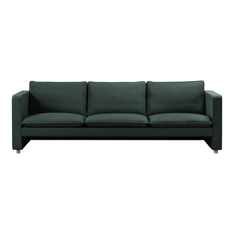 "Dark green upholstered sofa with a sleek design and plush cushions, featuring a minimalist aesthetic."