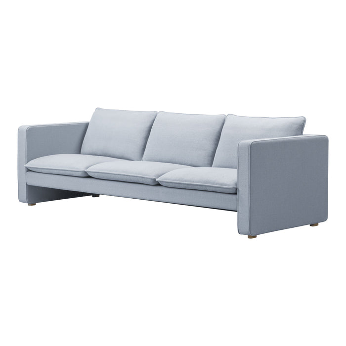 Light blue sofa with smooth, textured upholstery and minimalist design. Stylish addition to any modern living space.