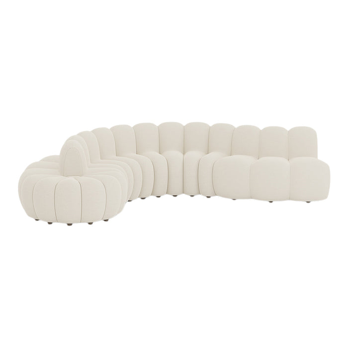 Curved white sectional sofa with soft, padded texture and round, tufted patterns. Ideal for modern decor.