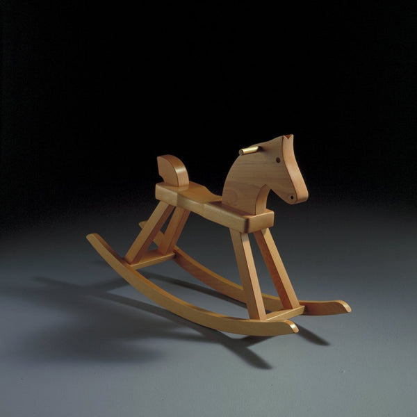 Natural wood finish rocking horse with smooth, minimalist design and unpainted surfaces highlighting grain patterns.