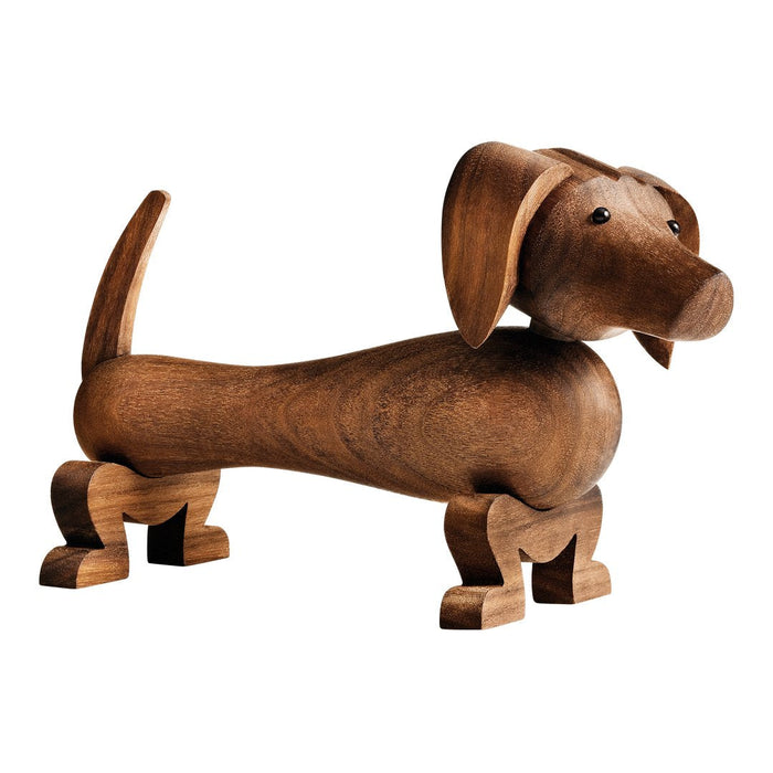Wooden dachshund figurine in rich brown, smooth finish with subtle grain texture and rounded forms, ideal for decor.