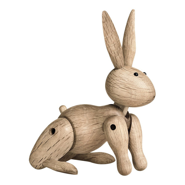Light wooden rabbit figure with natural grain pattern and smooth finish, featuring adjustable limbs and a playful design.