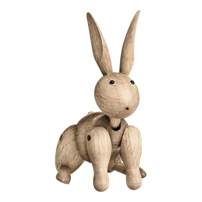 Wooden bunny figurine in a natural beige tone with smooth finish and minimalist design. Ideal for decor.