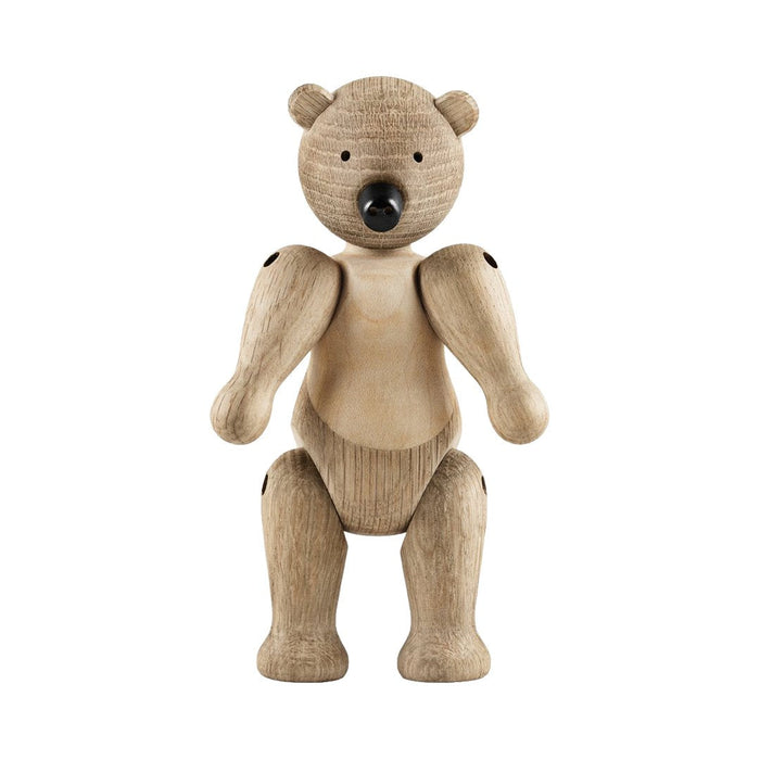 Wooden bear figurine in natural light brown with subtle grain patterns and black accents on the eyes and joints.