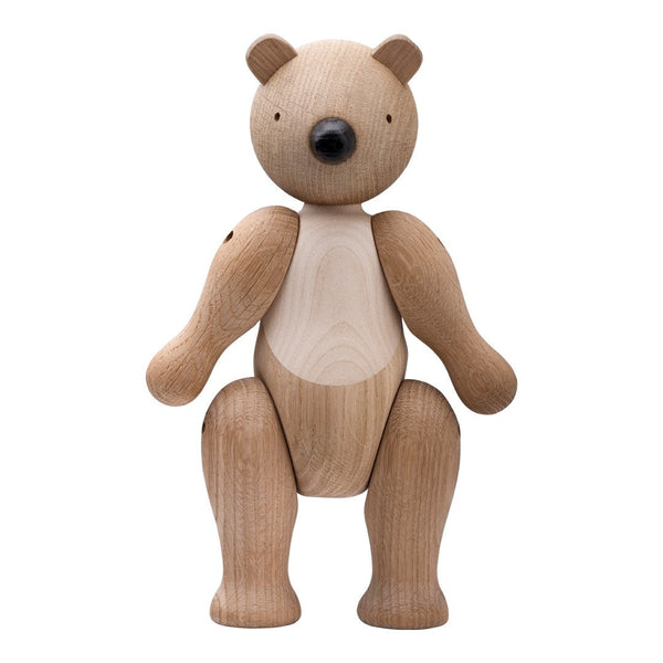Wooden bear figurine with light and dark brown hues, smooth finishes, and natural wood grain patterns.