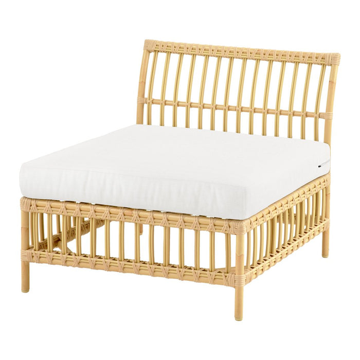 Natural rattan chair with a minimalist design, featuring a light beige cushion and a sleek, open slat pattern.