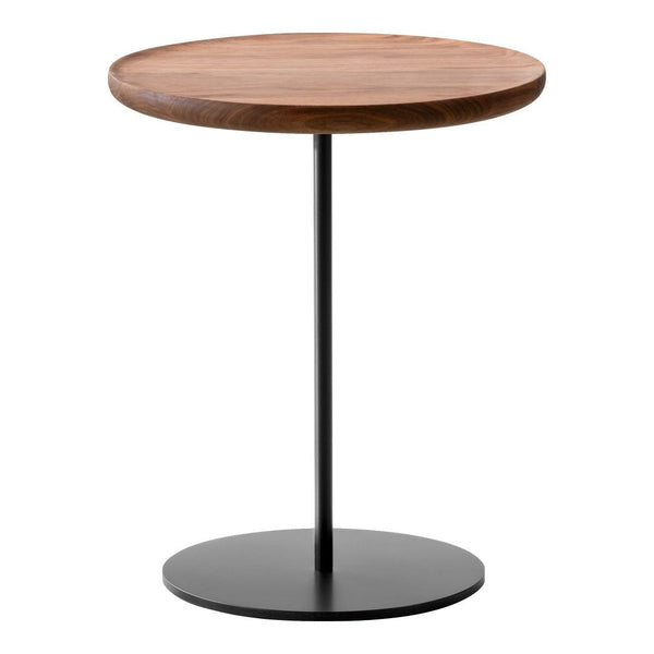 Round wooden tabletop in warm brown finish, supported by a sleek black metal base. Elegant and modern design.