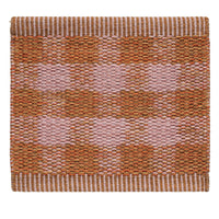 "Orange and pink checkered pattern rug with textured weaves and contrasting borders."