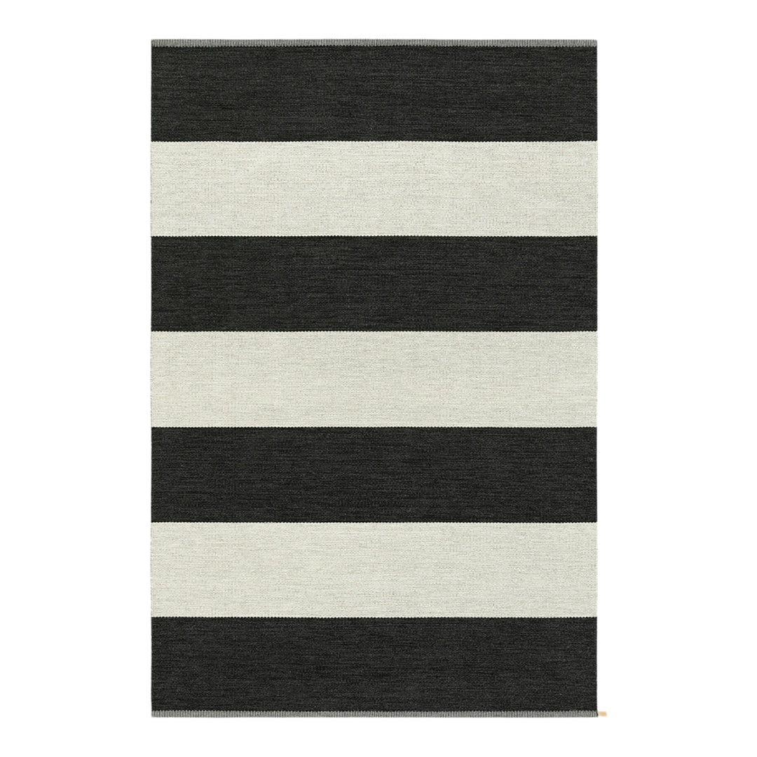 Black and white striped area rug with bold horizontal patterns, ideal for modern decor.