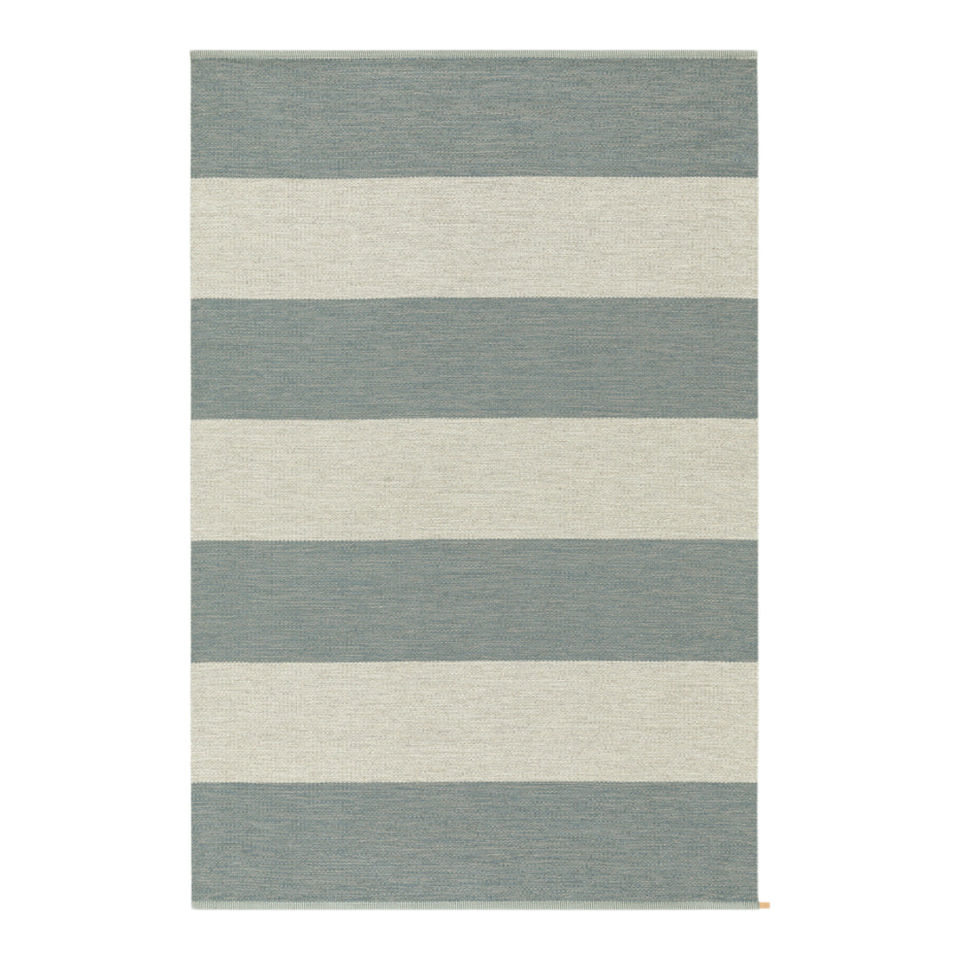 Soft blue and cream striped area rug with alternating wide stripes, ideal for modern home decor.