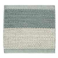 Textured area rug in soft teal and cream stripes with a woven pattern. Ideal for modern home decor.