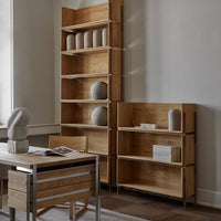 Natural oak wood shelving unit with clean lines and subtle grain pattern, enhancing a minimalist aesthetic.