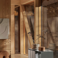 "Warm wood tones and soft neutral hues create a serene, modern interior with minimalist patterns."