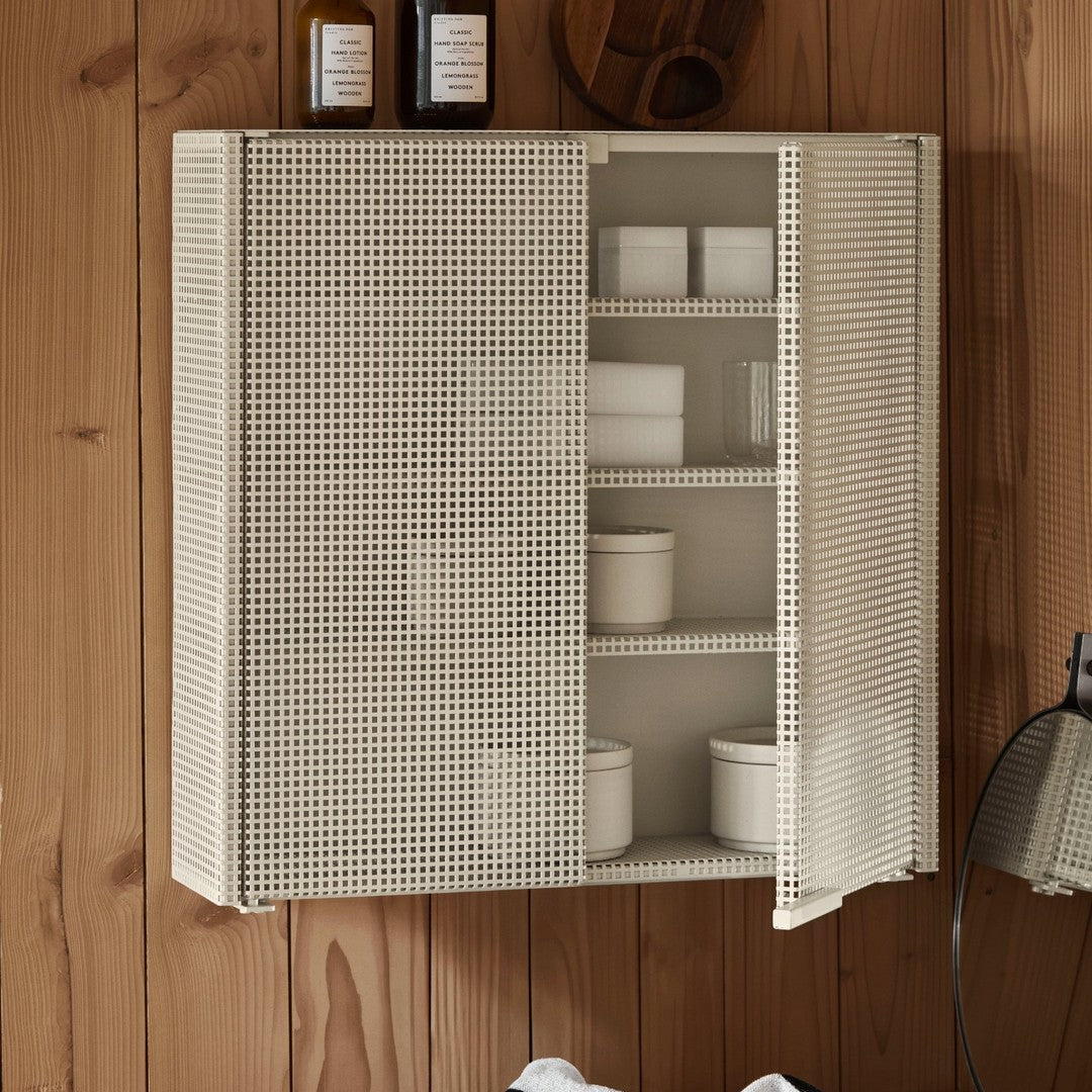 Cream-colored storage cabinet with a grid pattern, featuring multiple shelves and a minimalist design.
