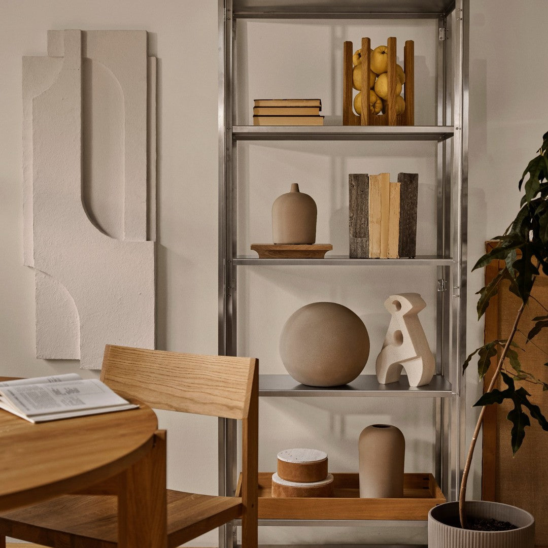 Neutral tones with textured patterns, featuring shades of beige, cream, and earthy brown, in a modern decor setting.