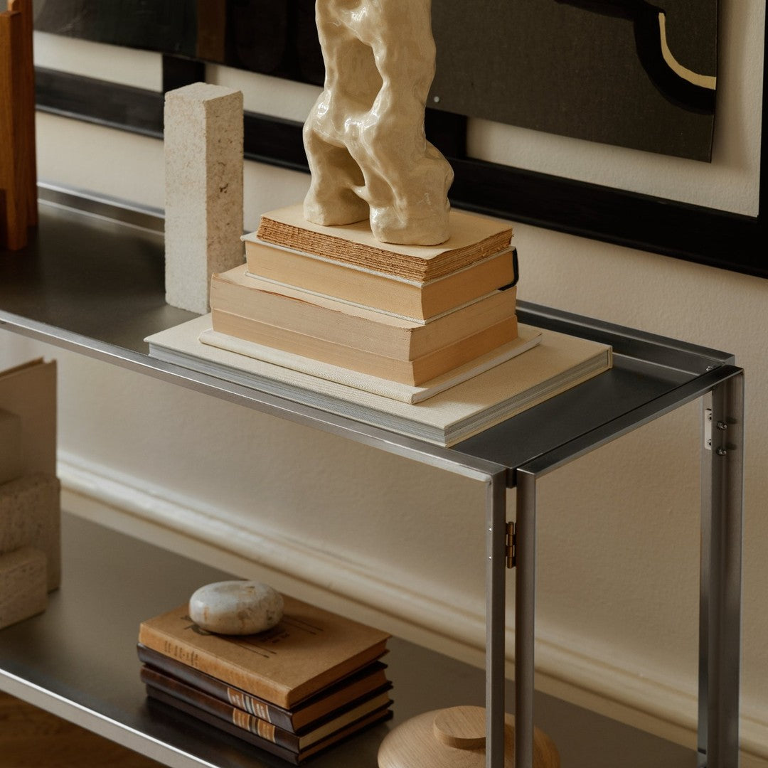 Modern tabletop display featuring neutral tones, smooth textures, and geometric patterns in natural and minimalist decor.