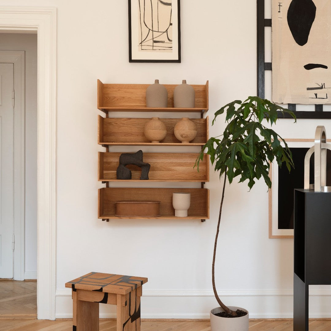 "Natural wood shelves with earthy tones, minimalist design, decorated with neutral ceramic vases and green plant accents."