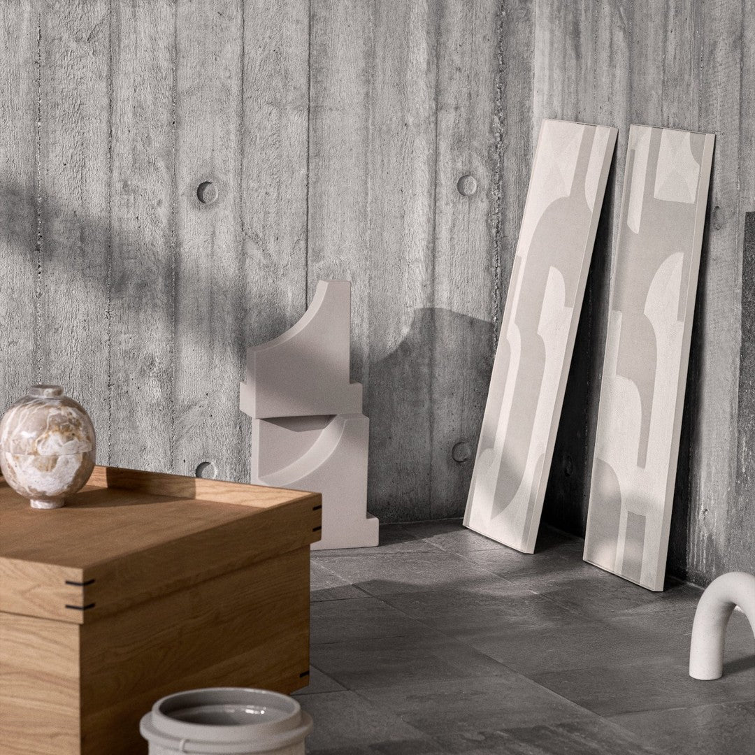 "Neutral-toned decor featuring geometric patterns, smooth finishes, and a modern gray and beige color palette."