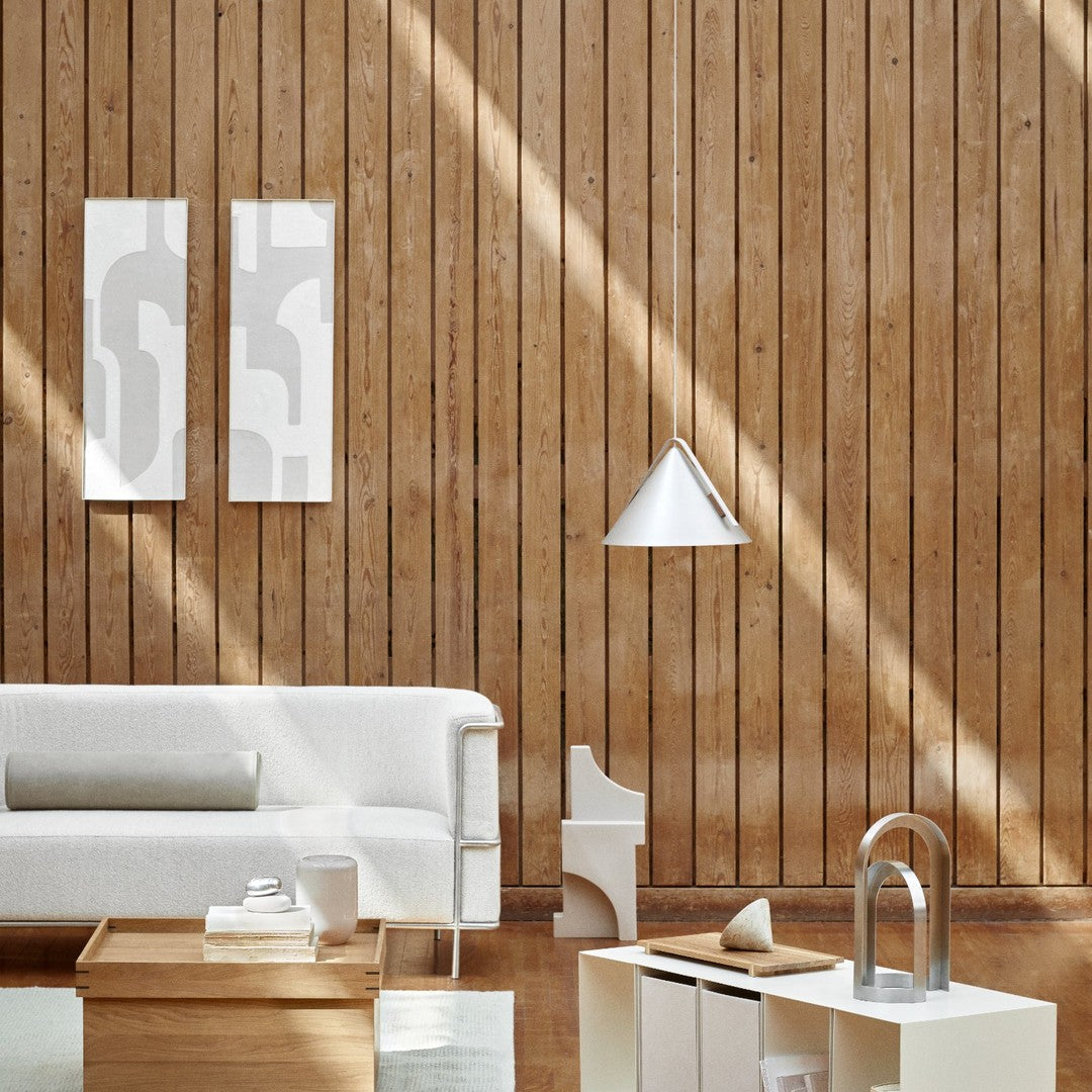Modern white decor with abstract gray patterns against warm wood paneling, creating a minimalist aesthetic.