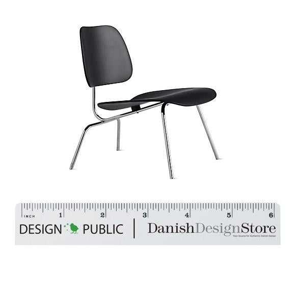 Black modern chair with a sleek design and chrome legs, featuring smooth, minimalist contours. Perfect for contemporary spaces.